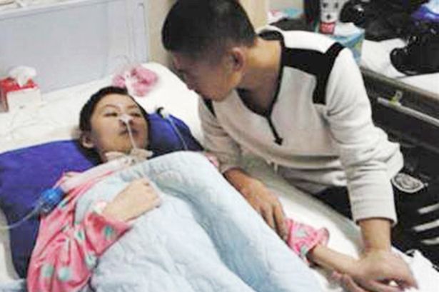 PAY-Liu-Fenghe-at-the-bedside-of-comatose-Lin-Yingying