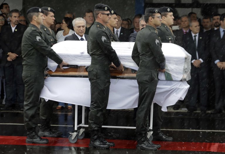 President Michel Temer attends the arrival ceremony of the coffins with the remains of Chapecoense soccer team victims, in Chapeco, Brazil, Saturday, Dec. 3, 2016. (AP Photo/Andre Penner)